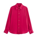 French-style shirt with gold buttons, tassels, and long sleeves