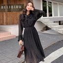Elegant chiffon dress adorned with a classic polka dot pattern