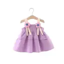 Elegant children's sling dress adorned with a floral print and a unique modern touch
