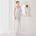 An elegant long evening gown adorned with dazzling floral sequin embellishments