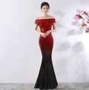 Elegant long evening dress designed to accentuate the figure and provide a charming feminine look