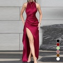 Elegant long dress with a side slit, open back, lace-up detail, and ruffle accents