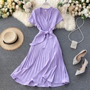 Plain satin V-neck dress with a defined waist and knee-length pleated skirt