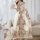 Floral maxi kaftan with an elegant oriental design, featuring a high neckline, long sleeves, and an adjustable waist belt