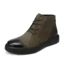 A modern men’s leather boot with a high-top design